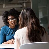 Counselling Services Two adults having a conversation.